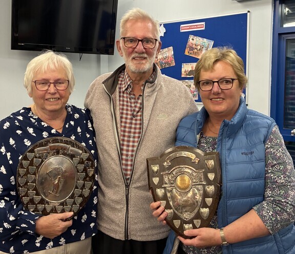 From Left to Right: Sheila Stockdale with the Teams Division 2 Trophy, Brian Stockdale the Guest of Honour, Ruth Johnson with the Teams Division 3 Trophy