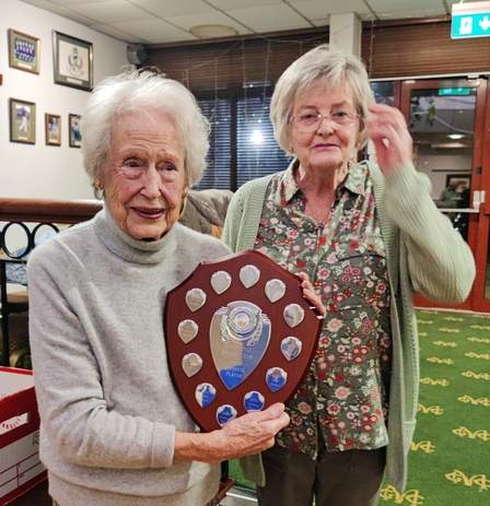 Anne presenting trophy to Moyna for winning every competition