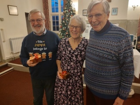 Frank and Eileen Christmas 2025 East West competition winners with our club Chairman Peter Jaram