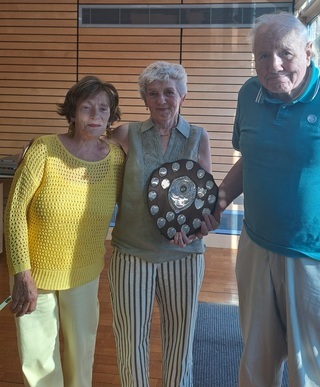 Lan Shield 2026 winners, Catherine and Dick accepting their Trophy from our outgoing President Emer.