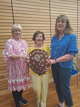Club President Emer presents President's Prize winners Fiona and Mary with their Trophy. The competition was played over 2 weeks on the 24th and 31st March 2026