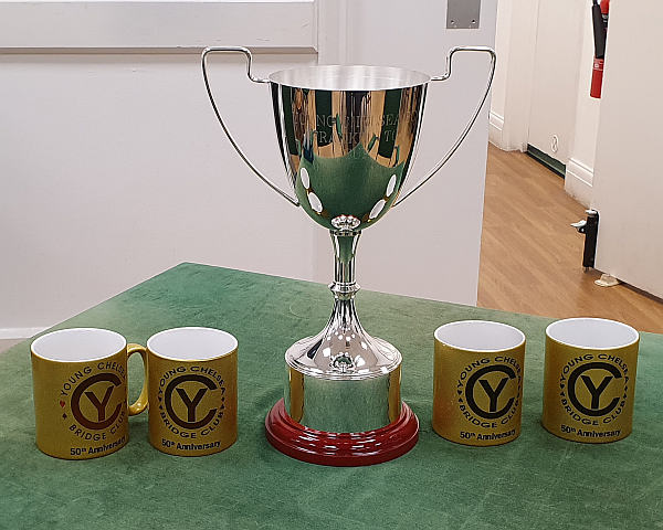 The Franklin To cup flanked by Young Chelsea anniversary mugs